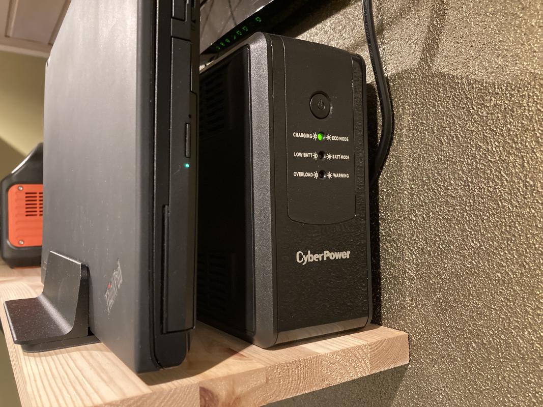 My ThinkPad-as-a-server, and the UPS that's powering it.