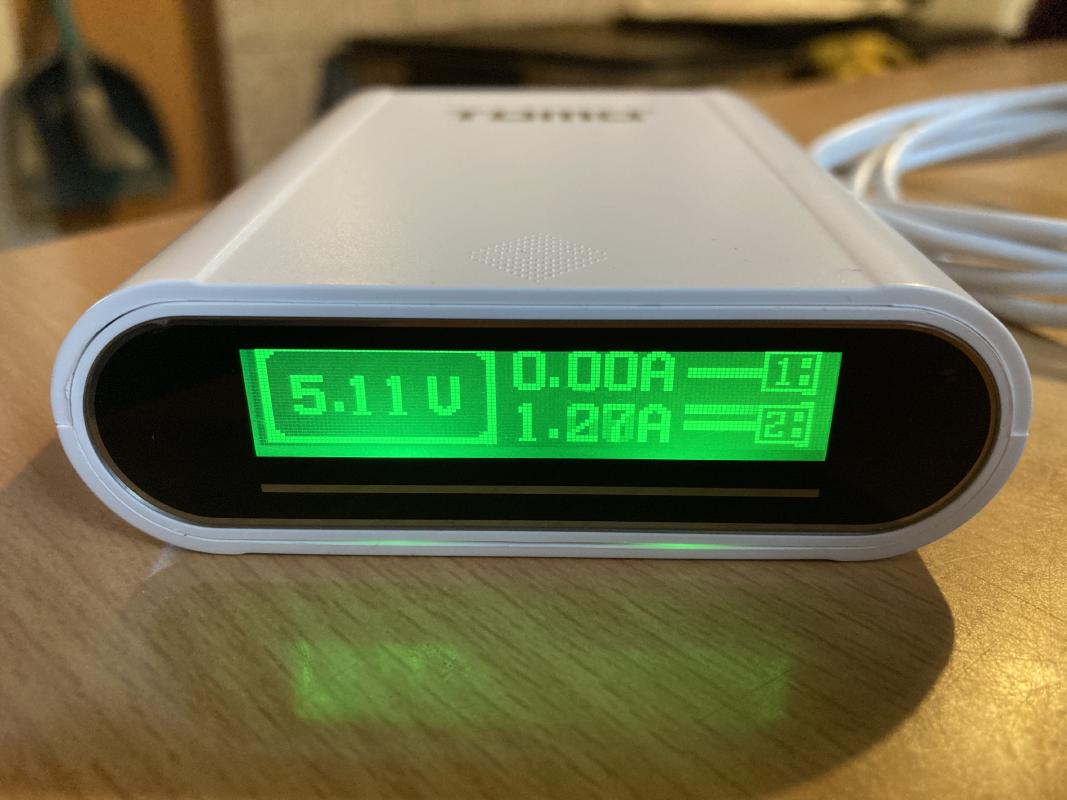 The display does exhibit ghosting, which is most noticeable during charging.