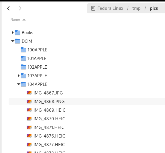 Photos are located under DCIM folder, nested into a bunch of subfolders.