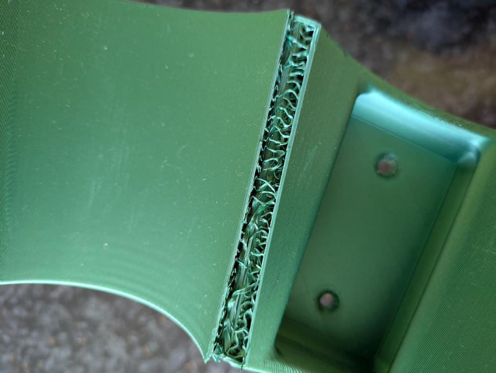 A broken Makita vacuum cleaner holder print. The patterns are interesting, though!