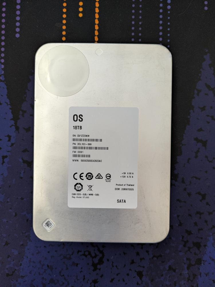 One of the hard drives. It does have slight dents and scratches, matching the description.