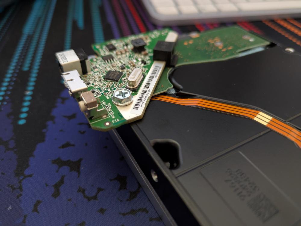 Those USB-SATA adapters from shucking are really darn handy now. Adapter courtesy of my brother-in-law.