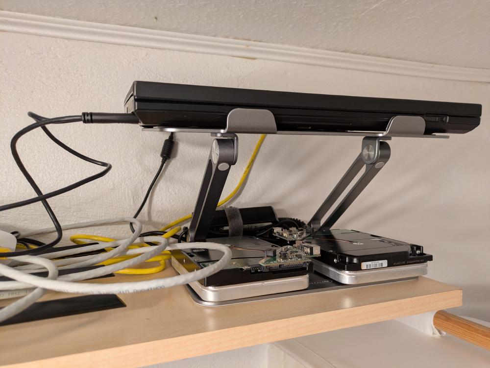 The drives are connected via two WD Elements/My Book USB-SATA adapters, over USB 3.0, and stored right below my ThinkPad
T430, which is proudly running as my home server.