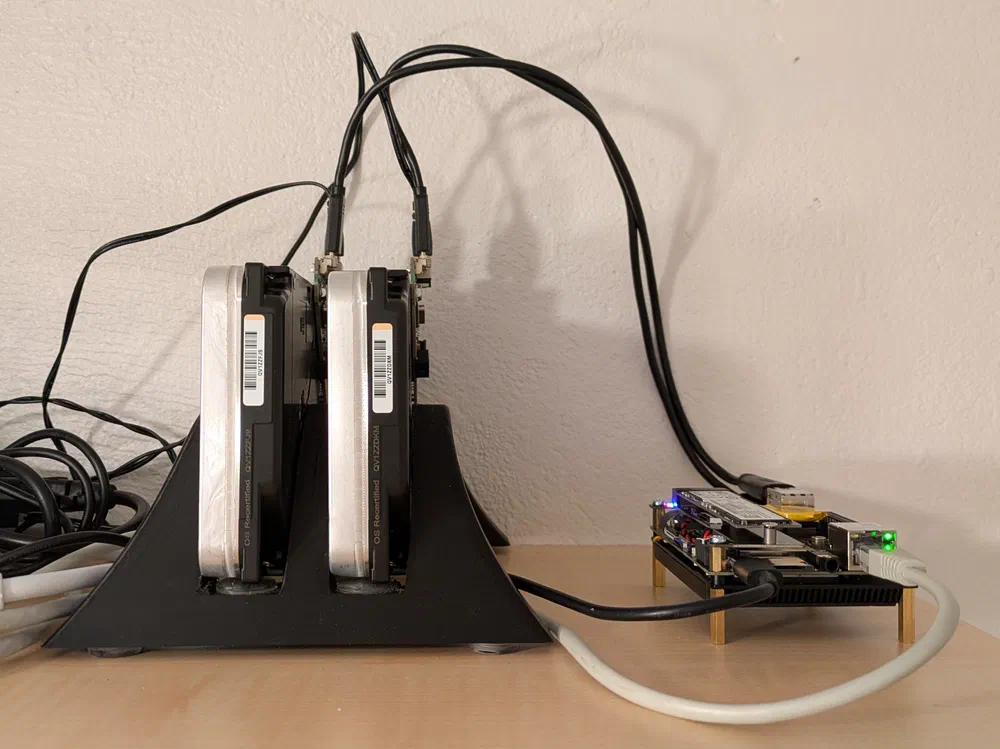 The LattePanda IOTA next to two 18TB hard drives, running as a home server.