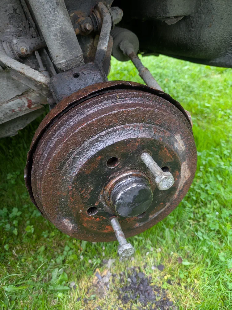The brake drums can get stuck. Lots of penetrating oil and two bolts that you screw in can help loosen them.
