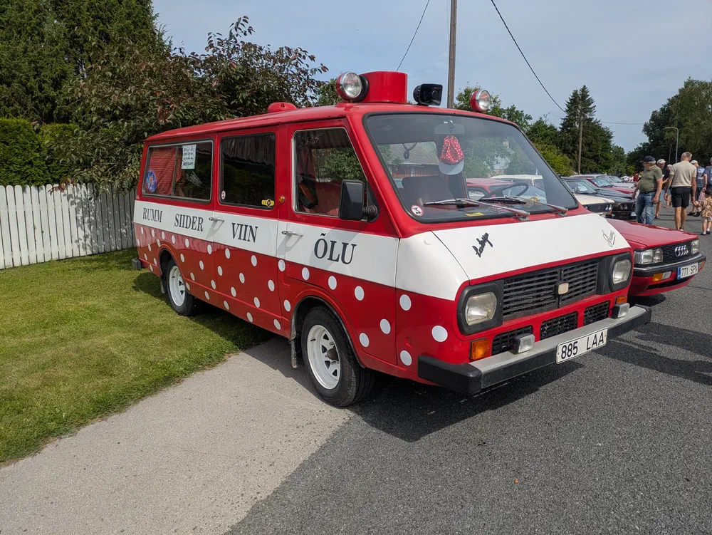 This former ambulance is now a party bus. This side reads "Rum Cider Vodka Beer".