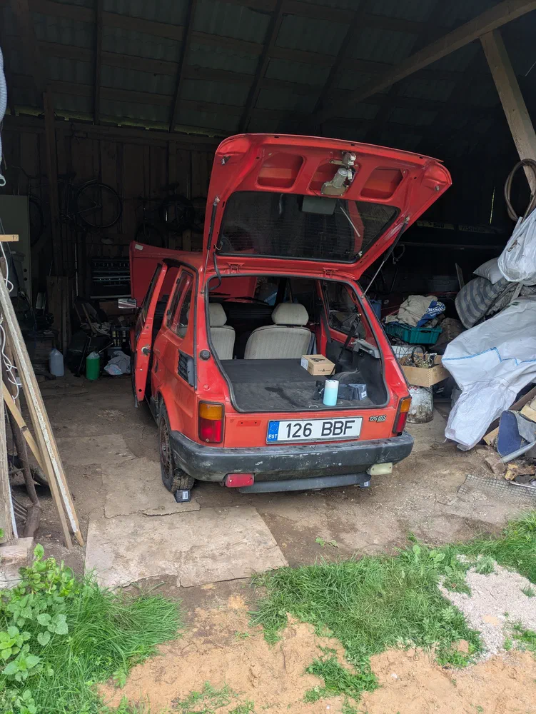 Wheelbarrow in a shed.